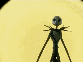 a statue of jack skellington from the nightmare before christmas is standing in front of a yellow background