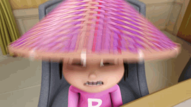 a girl wearing a pink shirt with the letter d on it