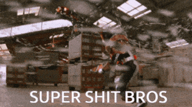 a man in a warehouse with the words super shit bros