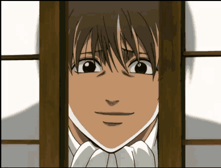 a close up of a cartoon character looking out of a window .
