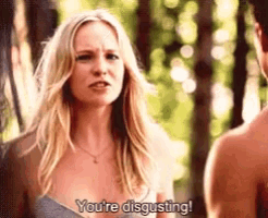 a woman is talking to a man in a forest and says you 're disgusting .