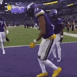 a football player with the number 7 on his jersey is dancing