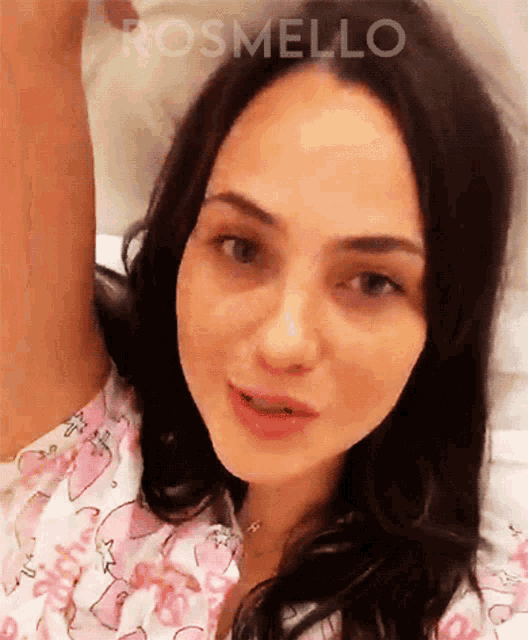 a close up of a woman 's face with the word rosmello visible