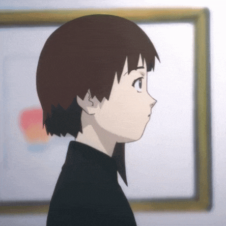 a girl in a black shirt stands in front of a picture frame