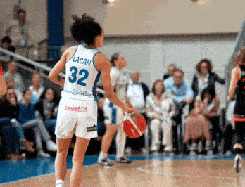 a female basketball player wearing a number 32 jersey