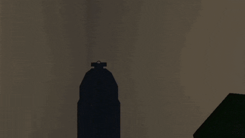 a person is standing in a dark room with a red crosshair on their pants .