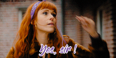 a woman with red hair and a purple bandana says yes sir