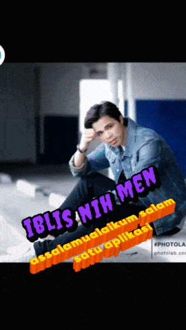 a man in a denim jacket sits on a bench with the words " iblis nih men " on the bottom
