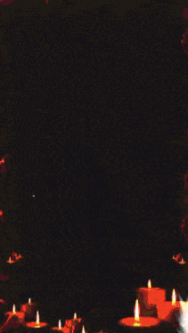 a bunch of candles are lit up in a dark room