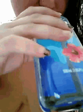 a close up of a person holding a cell phone with a blue case