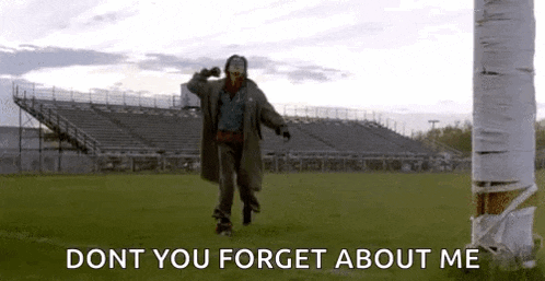 a man is riding a skateboard on a field with the words `` dont you forget about me '' written on it .