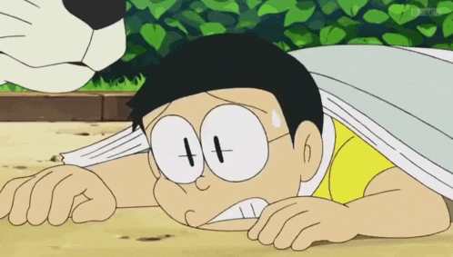a cartoon character with glasses and a yellow shirt is laying down on the ground