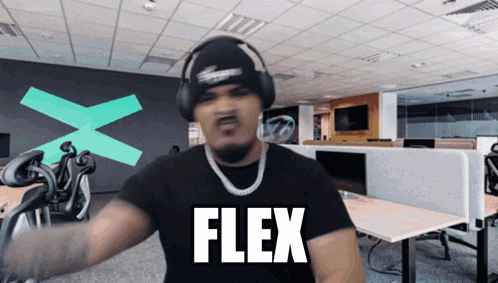a man wearing a black shirt that says flex