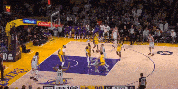 a basketball game between the lakers and the warriors is underway