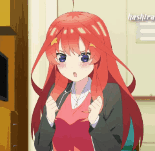 a girl with red hair and blue eyes is standing in a room