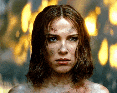 a close up of a woman 's face with a lot of blood on it