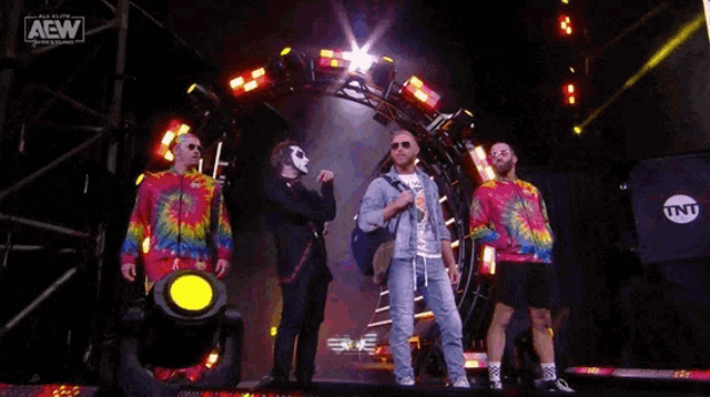 a group of men are standing in front of a sign that says " freshly squeezed " orange cassidy