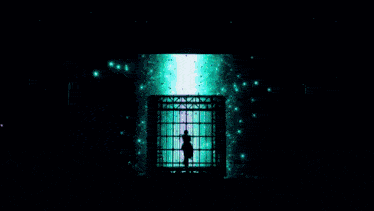 a silhouette of a man in a cage on a stage with green lights