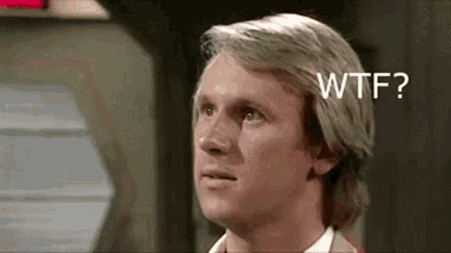 a close up of a man 's face with the words `` wtf '' written on it .