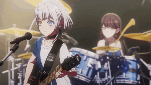 a girl is holding a guitar with esp on the strap