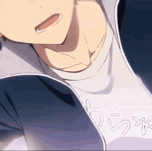 a close up of a person 's neck with a shirt that says ' a ' on it