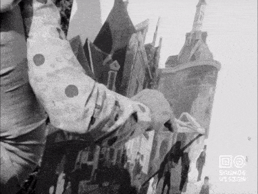 a black and white photo of a man painting a picture with the words sound & vision on the bottom