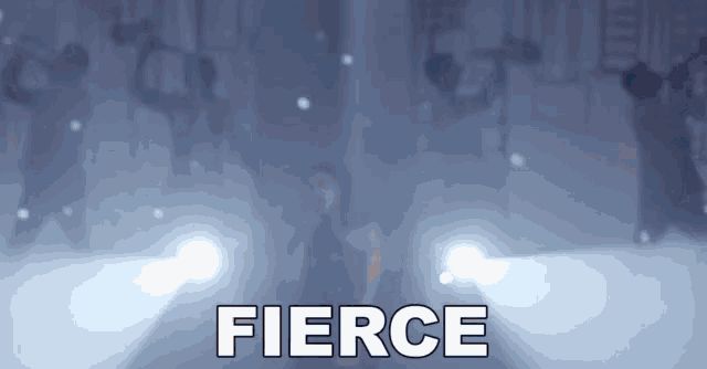 a woman singing into a microphone with the word fierce written above her
