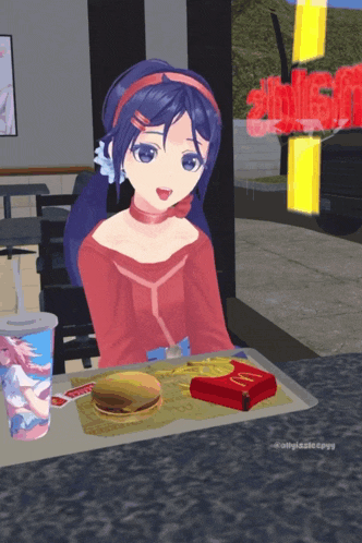 a girl is sitting at a table with a mcdonald 's box and a hamburger on it