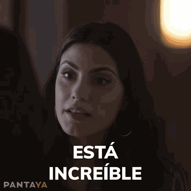 a woman says esta increible in spanish on a black background