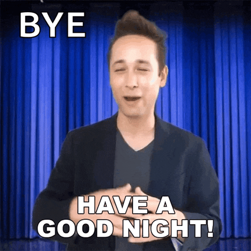a man says bye and has a good night in front of a blue curtain