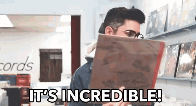 a man reading a book with the words it 's incredible written below him