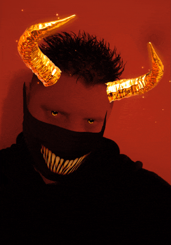 a man with horns on his head and a black mask