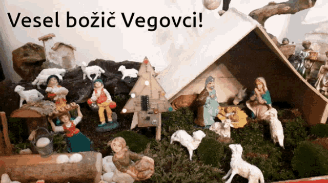 a nativity scene with the words vesel bozic vegovci on the top