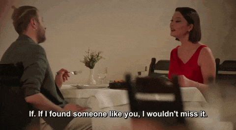 a man and woman are sitting at a table and the woman is saying if i found someone like you