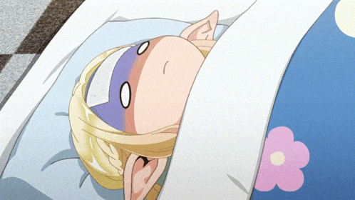 a cartoon character is laying in a bed with a flower on the blanket