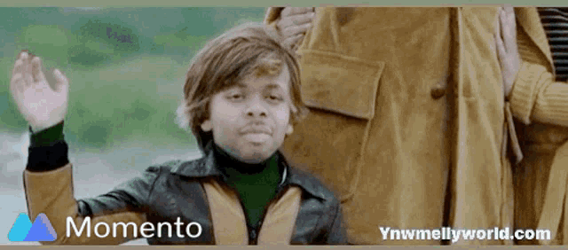 a picture of a boy with the words momento on the bottom right