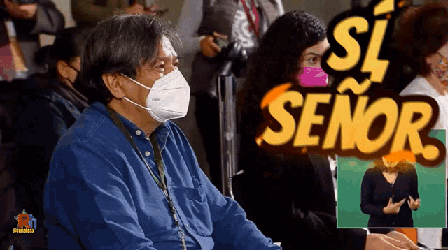 a man wearing a mask sits in front of a sign that says " si señor "