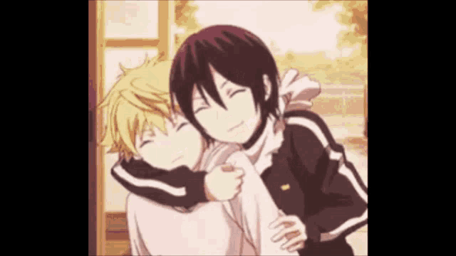 a couple of anime characters are hugging each other .