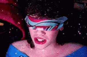 a pixelated image of a woman wearing a scarf around her eyes