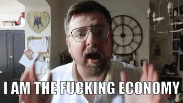 a man wearing glasses is making a funny face and saying i am the fucking economy .