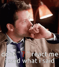 a man in a suit and tie is thinking and says " dont react me i said what i said " .