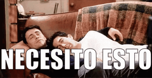 two men are sleeping on a couch with the words necesito esto written above them