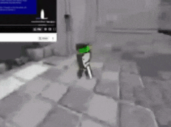 a cartoon character is standing on a tiled floor in a room in front of a computer monitor .