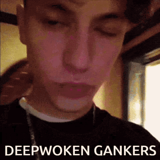 a close up of a man 's face with the words " deepwoken gankers " below him