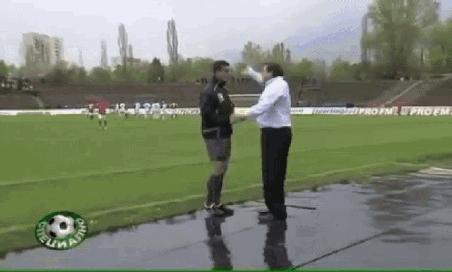 two men shaking hands on a soccer field with the word profi on the bottom