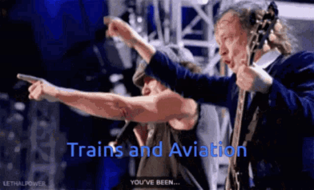 a man playing a guitar and another man pointing with the words " trains and aviation " written in blue