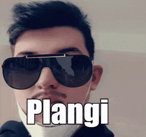 a man wearing sunglasses and a mask has the word plangi written on his face