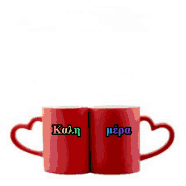 two red mugs with heart shaped handles that say kala mera on them