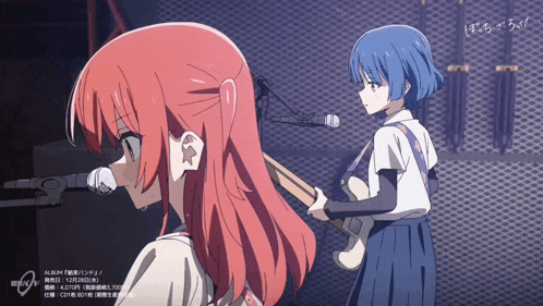 a girl with red hair is singing into a microphone while a girl with blue hair is playing a guitar