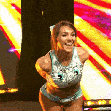 a woman in a pokemon costume is dancing on a stage